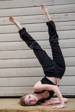 Serendipity dancer holding an inverted pose